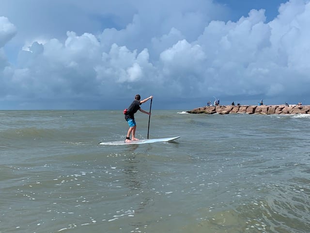 paddle boarding in galveston seawall beach